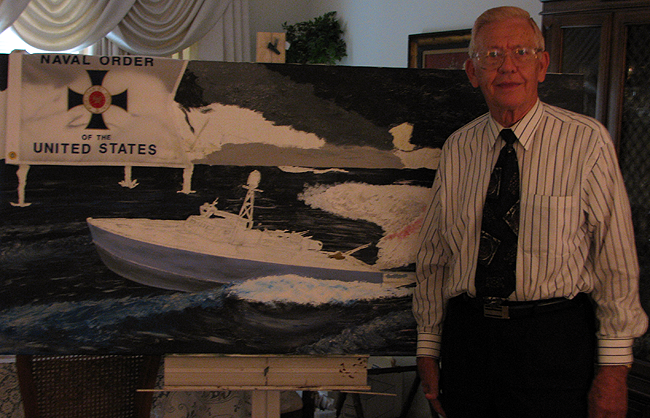 image of Clyde Combs in front of a painting of patrol torpedo boat