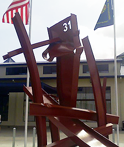 image of new sculpture made of steel beams from the burned warehouse with the number 31 to honor the firefighters