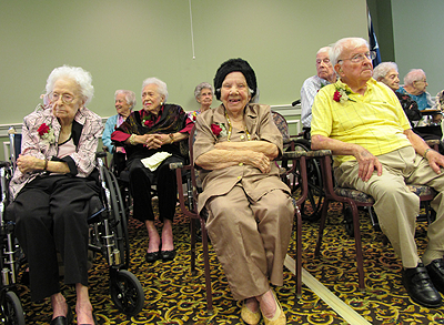 Carol Walker, Mary Tucker and Henry Prentice enjoy a party for centenarians in the Houston area.