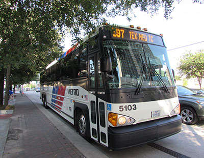A METRO commuter bus in downtown Houston.