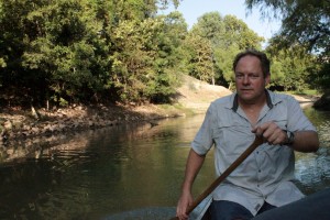 Tom Helm paddles down Buffalo Bayou
