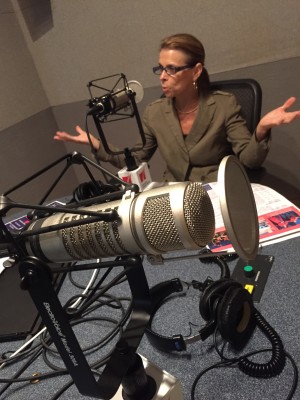 Theater District Houston CEO Kathryn McNiel being interviewed in the Houston Public Media radio studio