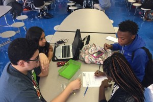 Tenth graders work on a chemistry project together