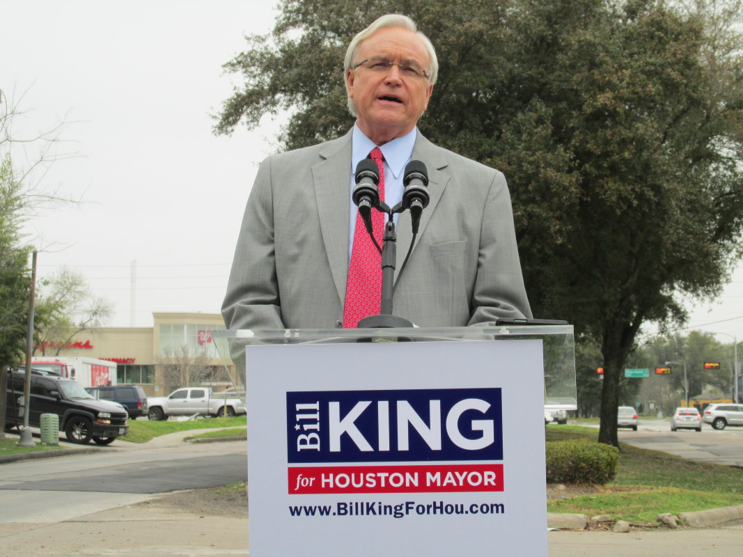 Bill King speaking from behind a podium 