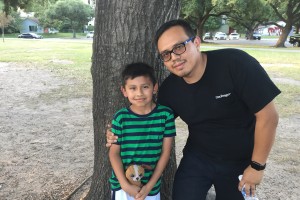 Fernando Aguilar stands with his son Isaac at Stude Park.