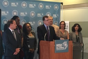 HISD school board members flanked Superintendent Terry Grier as he announced his resignation.