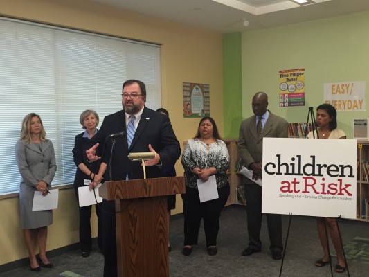 Bob Sanborn with Children at Risk speaks with other education advocates at a Houston elementary school