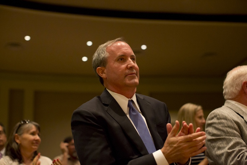 Ken Paxton clapping