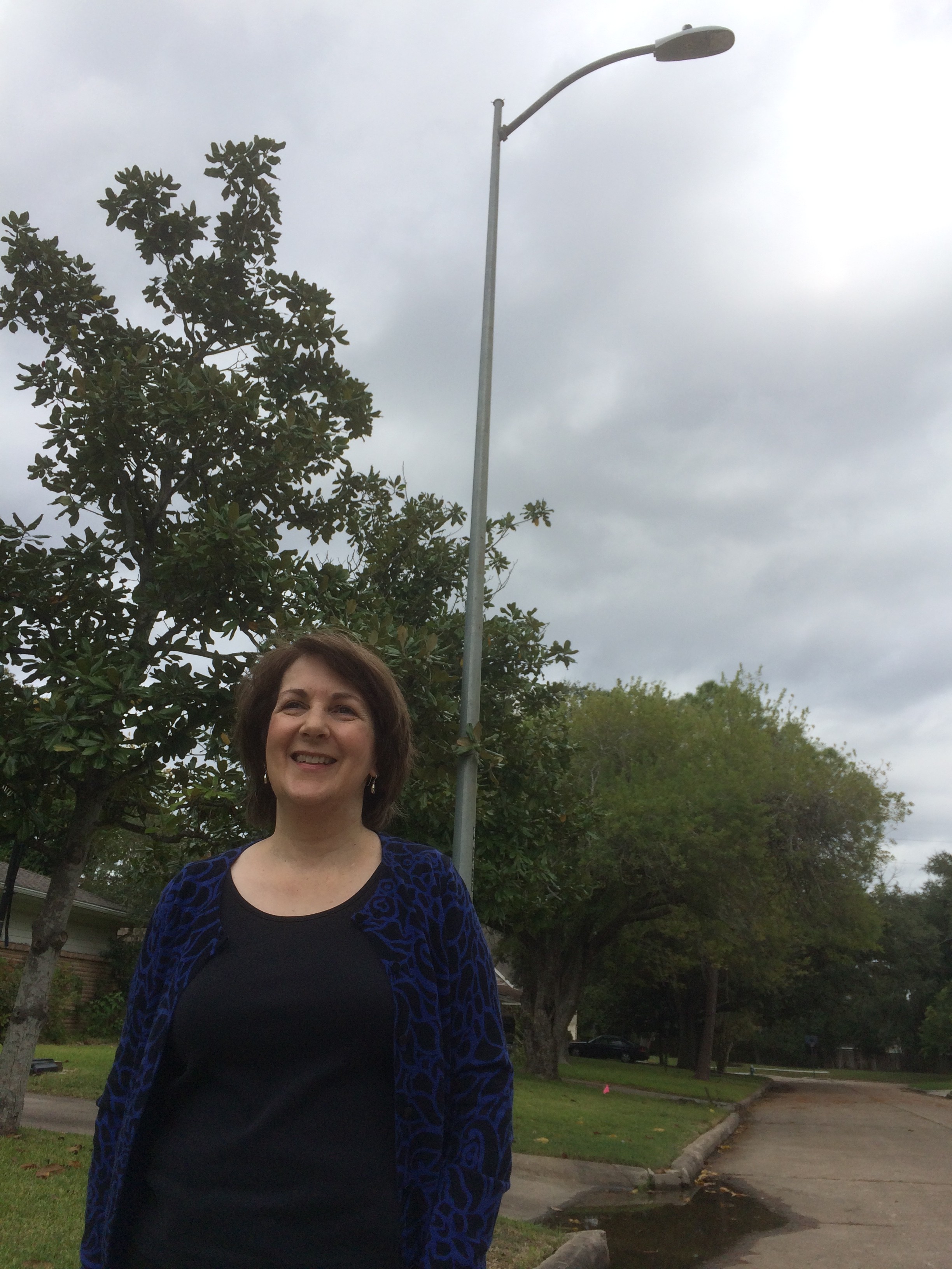 Debbie Moran in front of a light pole