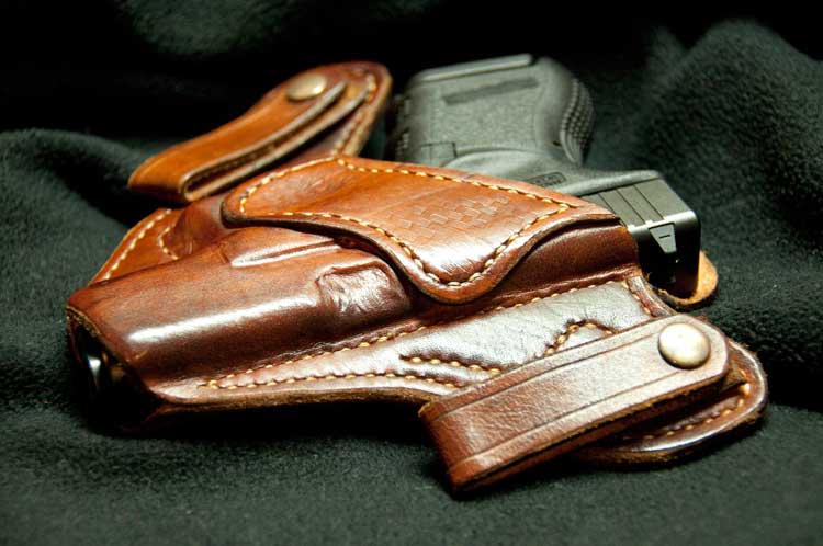 A  concealed gun inside a holster