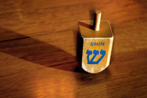 Dreidel. נ (Nun), ג (Gimel), ה (Hei), ש (Shin)
Nun stands for the Yiddish word nisht (