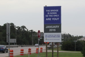 Signs at HCTRA Ship Channel Bridge advising drivers of conversion to all-electronic tolling.