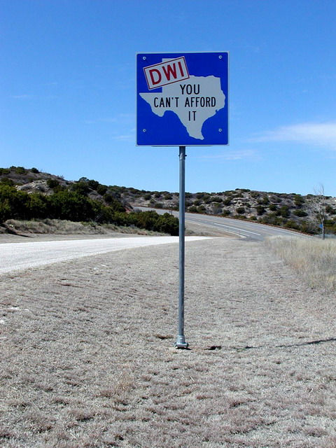 Sign reads, DWI, You can't afford it