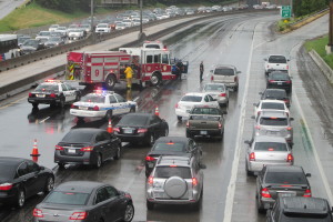 Houston Police clear an accident on rain-slick I-45.