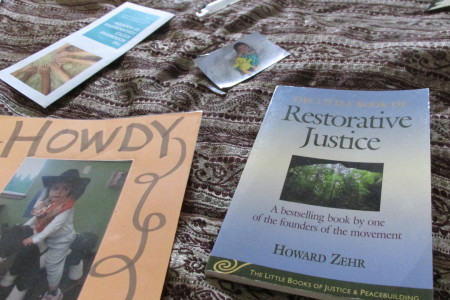 Restorative Justice books lie on a blanket at the Academy of Choice