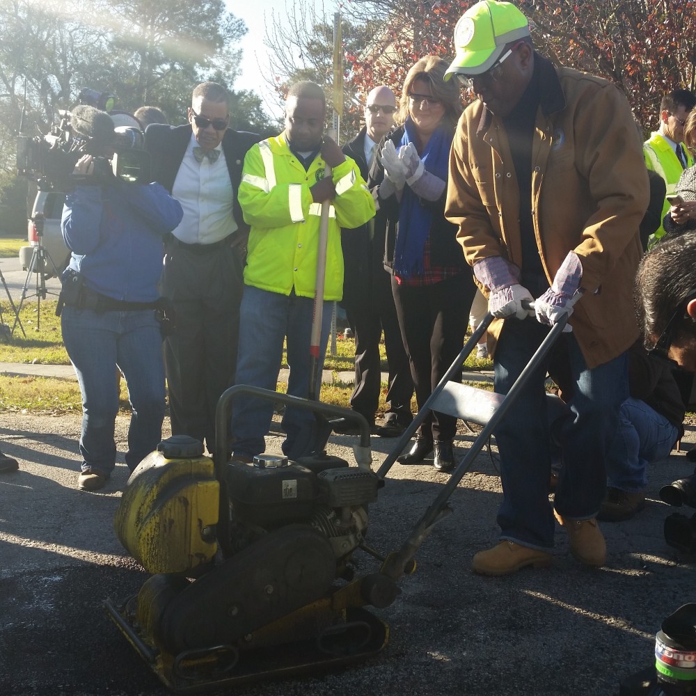 Mayor Turner fixing a pothole