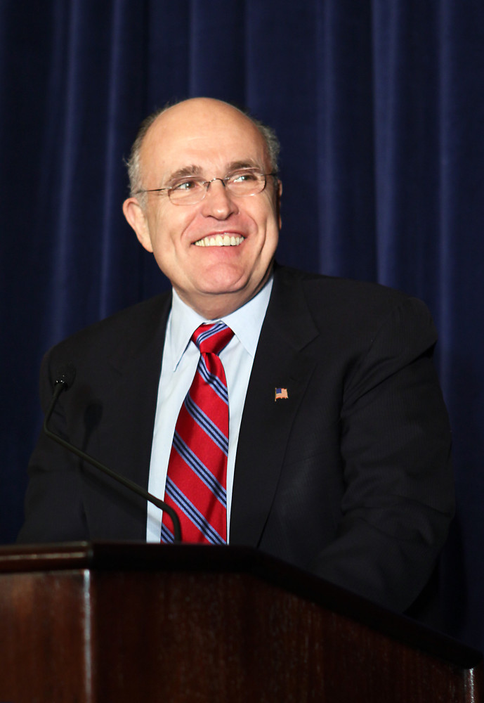 Rudy Giuliani standing at a podium