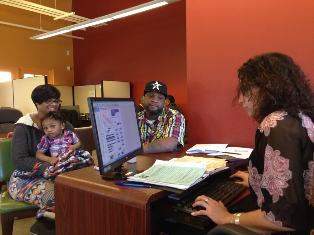 From left to right: Ebony Turner, her daughter Jaylen, Timothy Turner and Sonia Gervazio. The Turners went to Neighborhood Centers to get their tax return for 2015 ready free of charge. (Photo: Al Ortiz)
