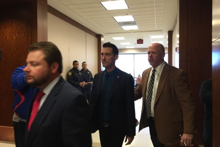 David Daleiden is led out of a Harris County courtroom by his attorney Terry Yates.
