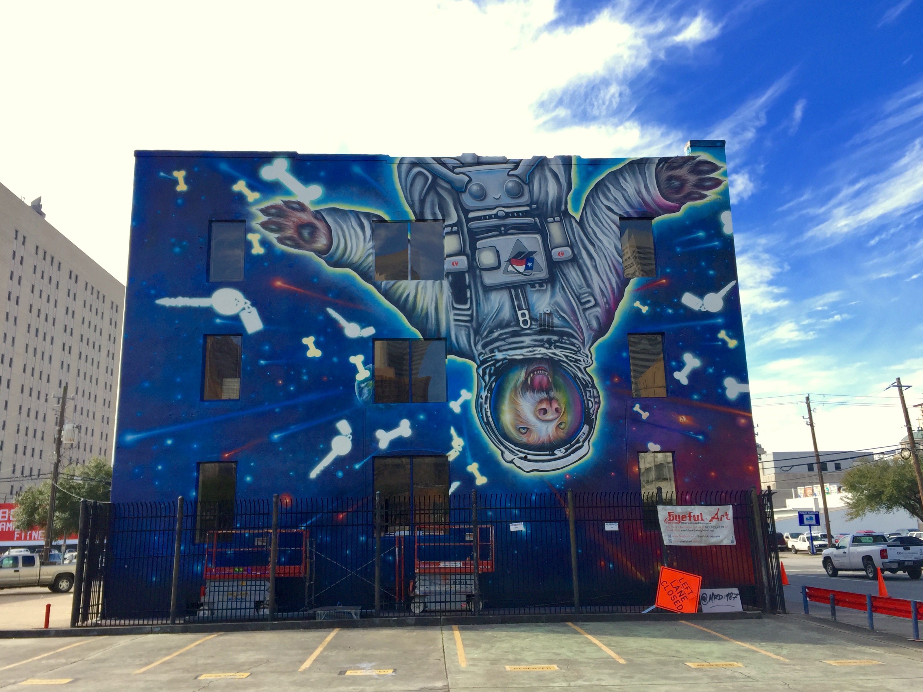 Picture of Space Suite Dog mural on Texas Direct Auto building