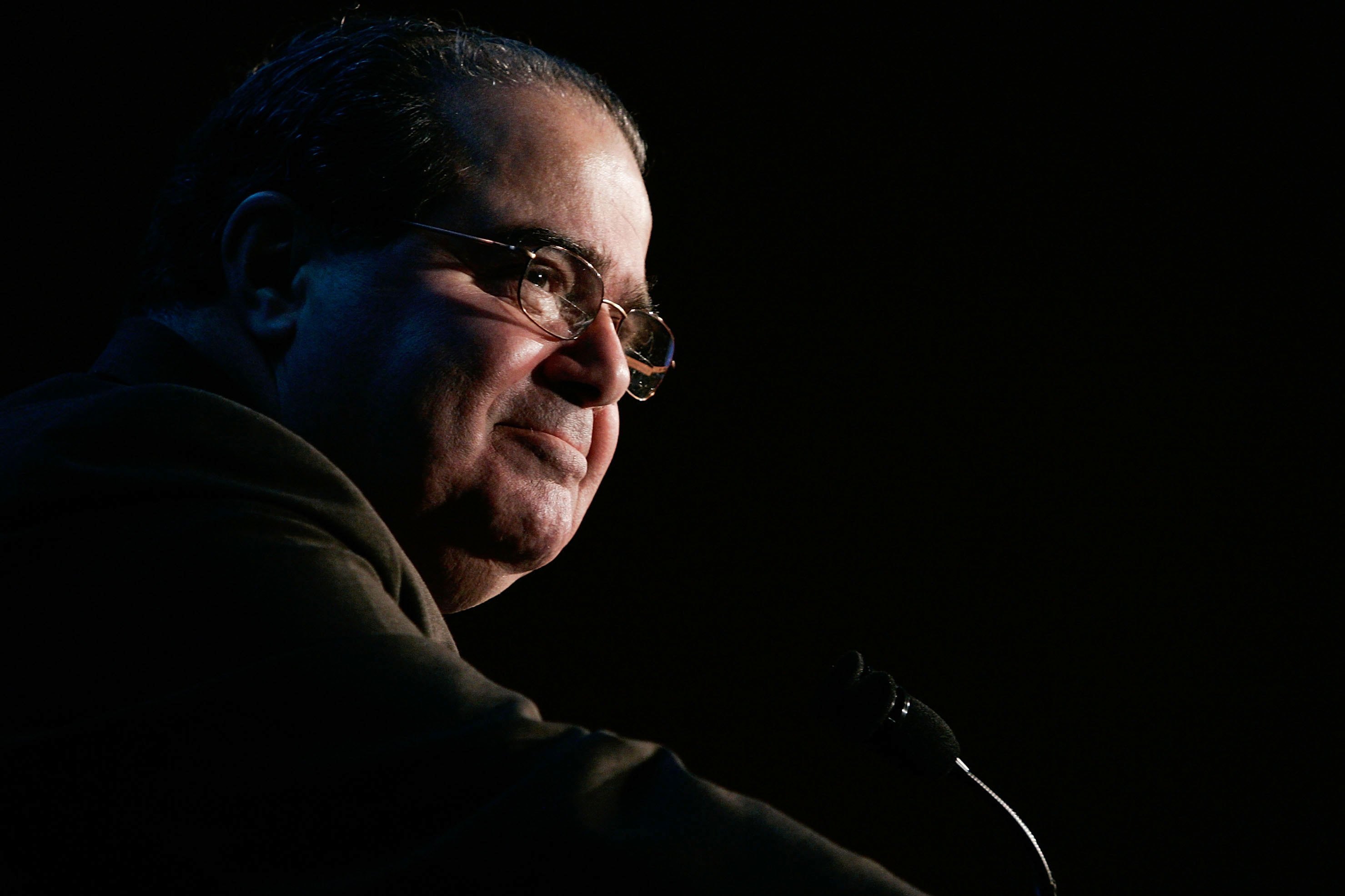 U.S. Supreme Court Associate Justice Antonin Scalia pauses as he addresses a Northern Virginia Technology Council breakfast in December 2006 in McLean, Va.