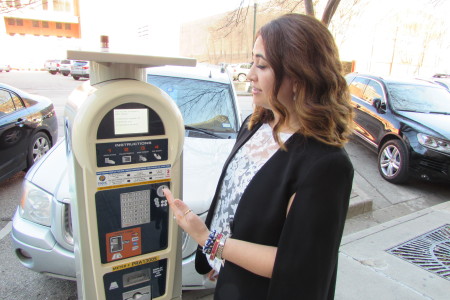 Houston Parking Official Maria Irshad demonstrates new parking meter.