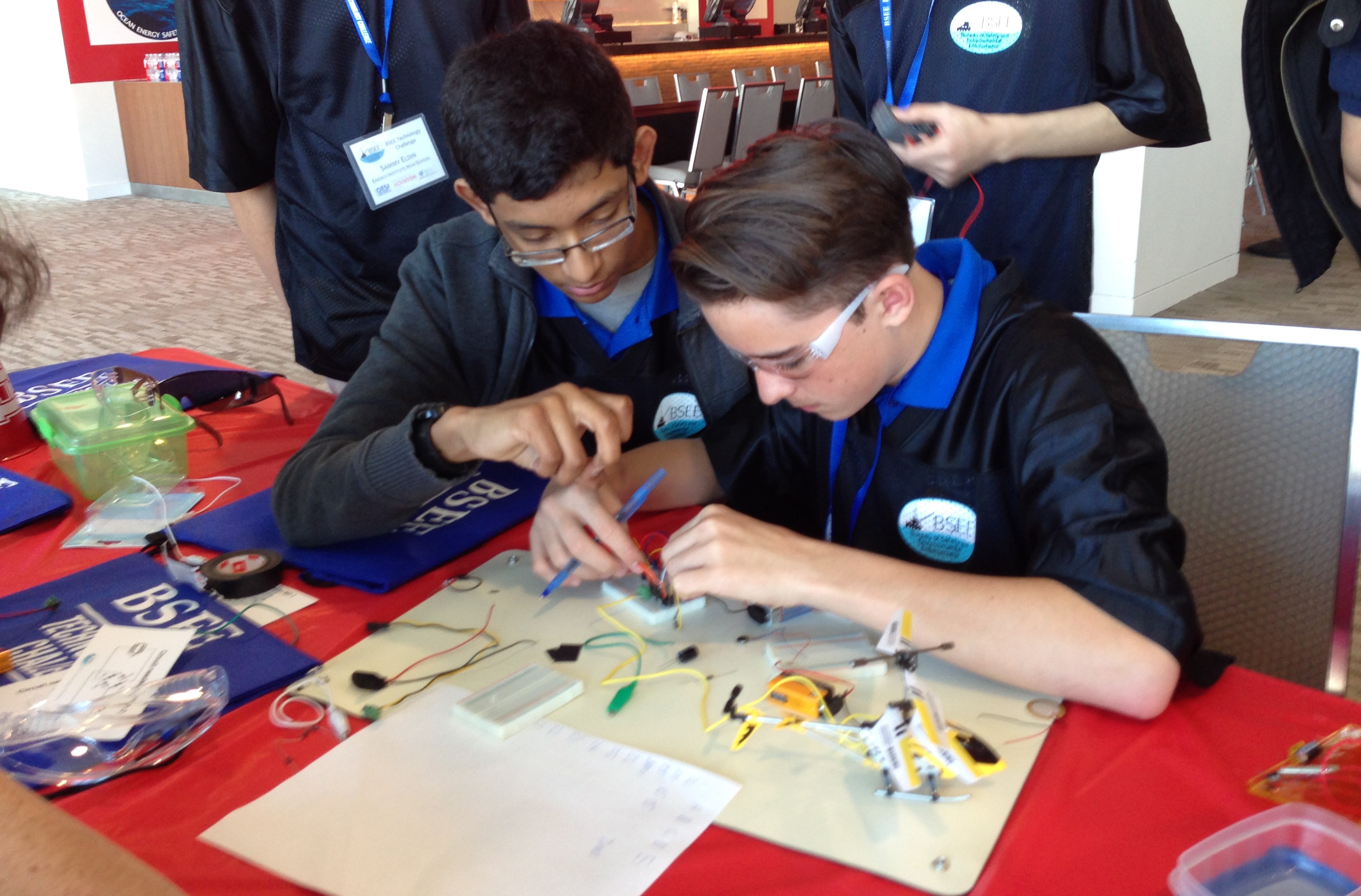Jose Saravia and Matthew McEwan review the connections of one of the devices they used in the competition.