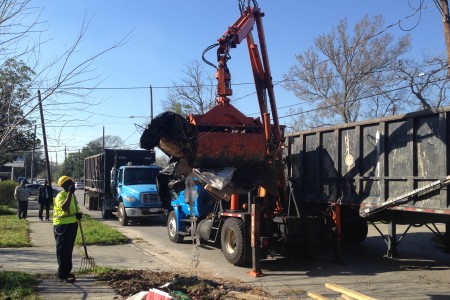 Kenneth Munson, on the left hand side of the photo, a worker with the Department of Solid Waste Management, cleans up heavy trash sites in District B as part of the City’s plan to reduce breeding grounds for mosquitoes and subsequently combat the spread of diseases they may carry, such as the Zika virus.