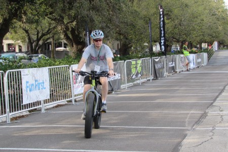 A rider tries out an electric bike at Rice University.