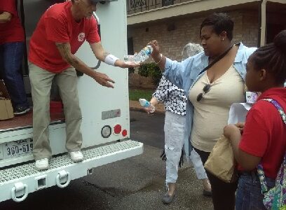 Delivering essential food items to flood victims.