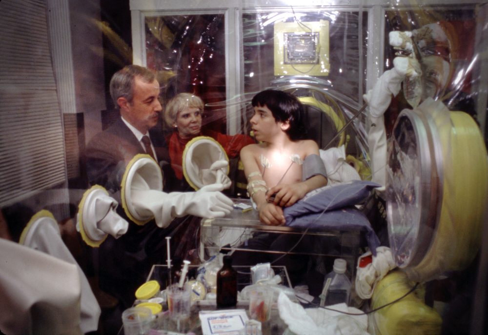David Vetter speaks with Dr. William Shearer during preparations for the experimental bone marrow transplant in 1983. (Photo Credit: Baylor College of Medicine)