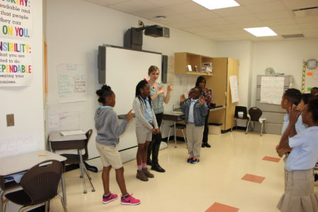 Teaching artist Brandy Reichenberger with Main Street Theater leads third grade students at Atherton Elementary in theater skits and games to reinforce science lessons about light movement.