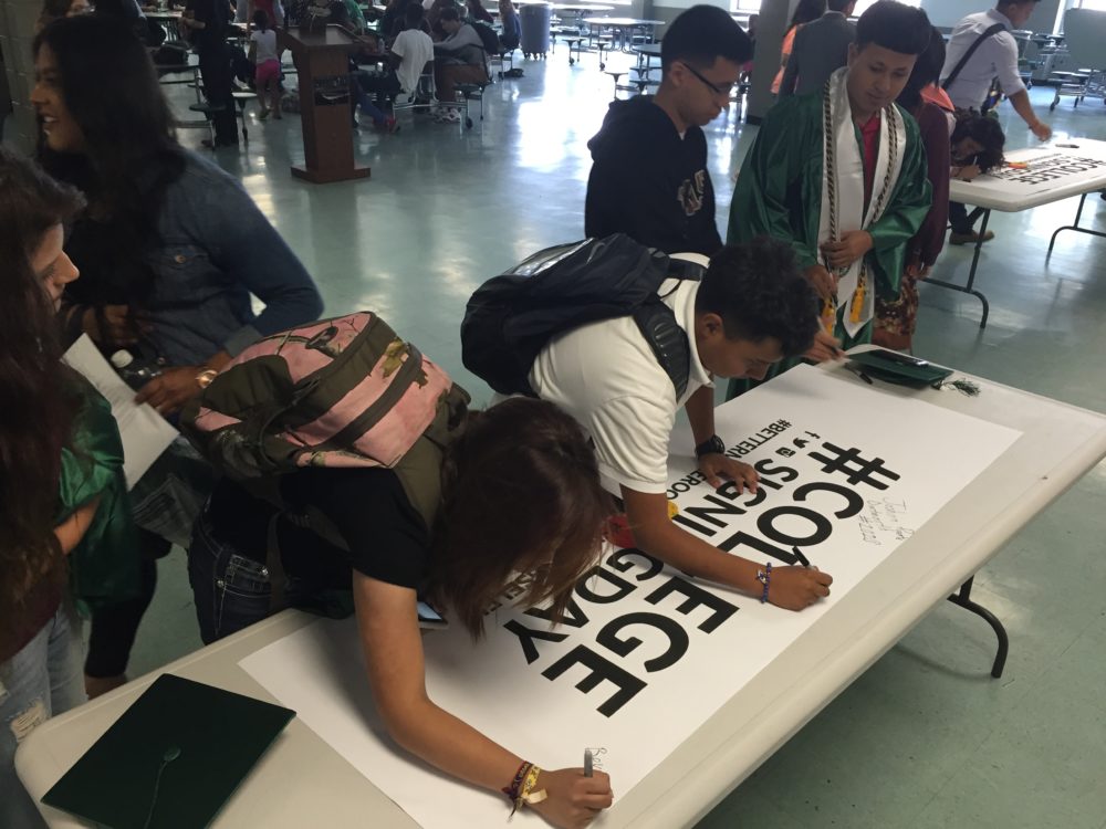 Seniors at Austin High School participate in a college signing day to celebrate their next steps after high school.