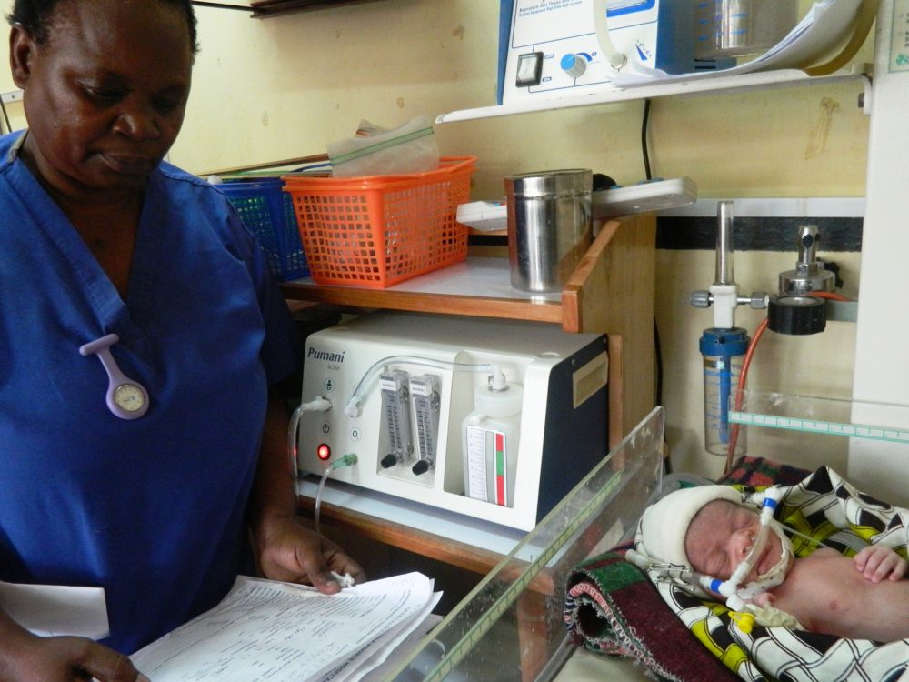 Neonatal nurse Florence Mwenifumbo monitors a newborn that is receiving bubble CPAP treatment at Queen Elizabeth Central Hospital in Blantyre, Malawi.