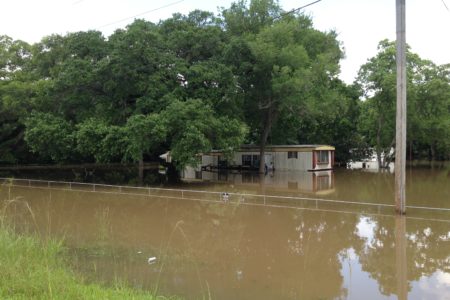 Some parts of Brazoria County are still surrounded by high water. This file photo shows a home located in the Angleton area that was flooded due to the severe weather south east Texas has experienced since the end of May.