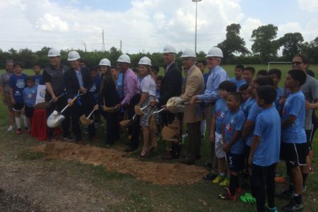 Officials with the city of Houston, Harris County Houston Sports Authority, NCAA and others break ground on the new soccer field at Milby Park.