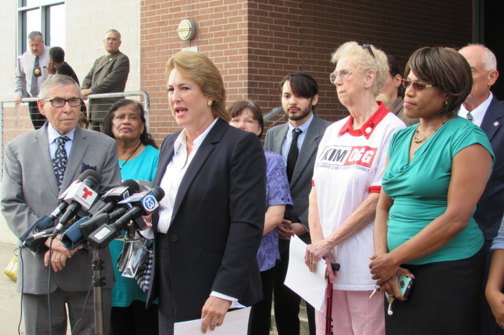 Kim Ogg stands with supporters outside the Harris County Jail. Ogg is challenging Devon Anderson for Harris County District Attorney. 