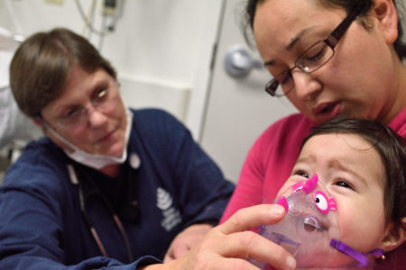 Xiadani Alvarez gets a respiratory treatment in the pediatric emergency room at Texas Children's Hospital.