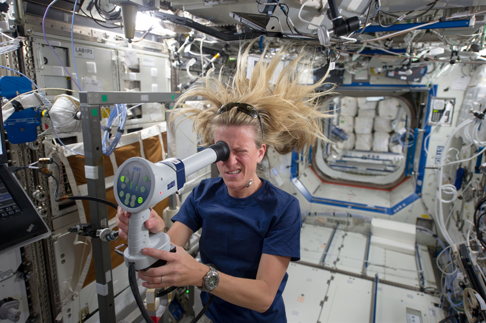 Visual Impairment Intracranial Pressure Syndrome was identified in 2005 and is currently NASA's leading spaceflight-related health risk. Here, NASA astronaut Karen Nyberg of NASA uses a fundoscope to image her eye while aboard the space station. (image Courtesy: NASA)