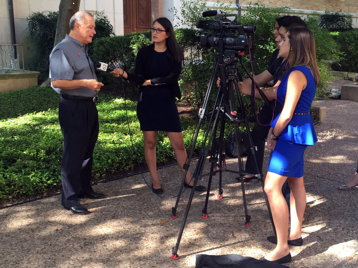 Texas Secretary of State Carlos Cascos with reporters from Spanish-language TV Telemundo and Univision talking about the VoteTexas campaign.