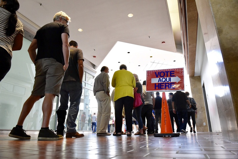 Voters lined up at the Austin Community College Highland Campus in Austin for the first day of early voting on Oct. 24, 2016.