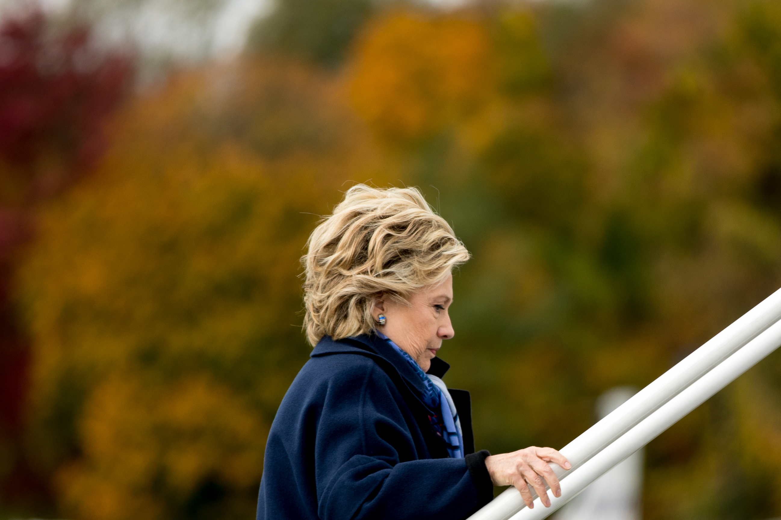 Hillary Clinton boards her campaign plane at Westchester County Airport in White Plains, N.Y., on Friday. The FBI said Friday it will be looking into newly discovered emails related to Clinton's private server