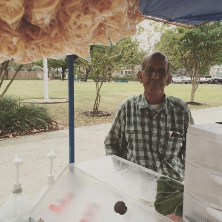 A man sells ice cream with his  mobile cart at the Ripley House Community Center in the East End.