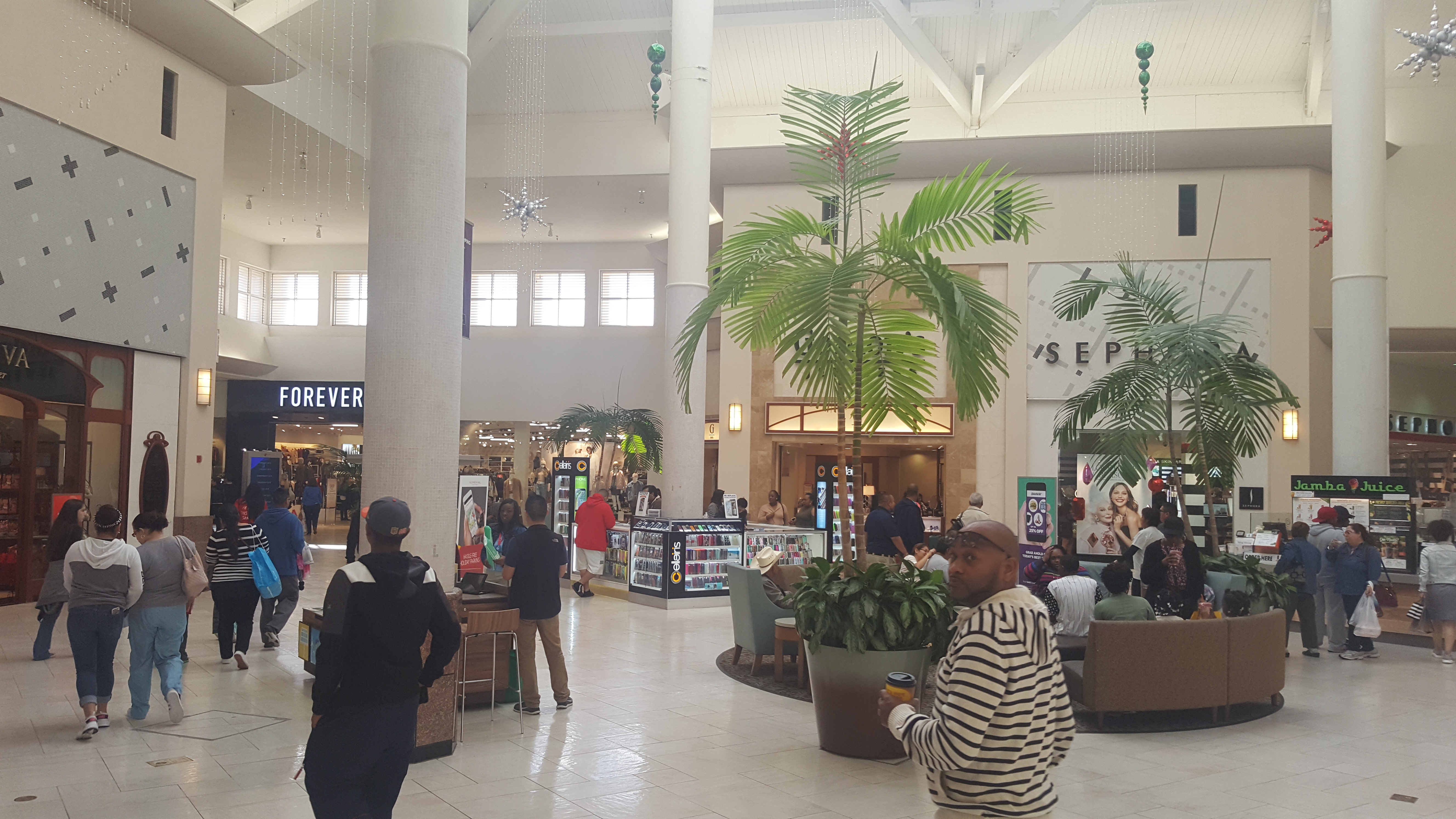 Shoppers walking around Willow Brook Mall in North West Houston.