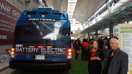 Officials check out Metro's new electric bus at the Downtown Transit Center on November, 29th 2016.