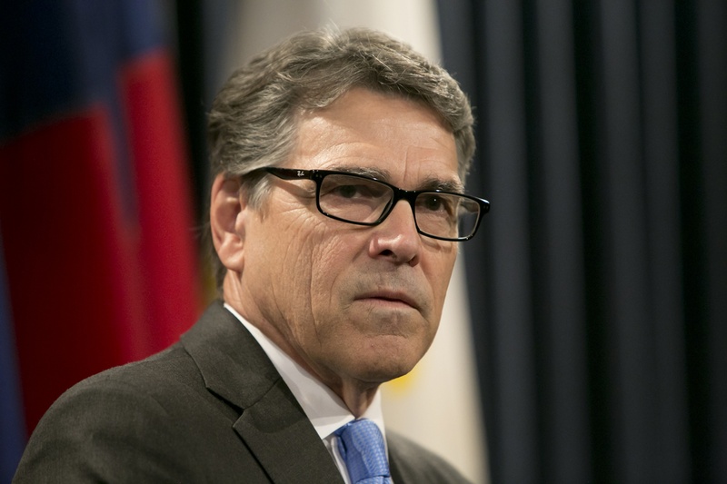 Gov. Rick Perry addresses media at a press conference following the unveiling of his official portrait at the Texas Capitol on May 6, 2016