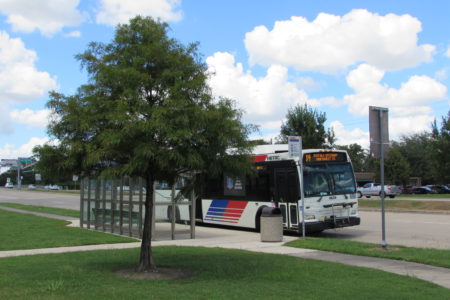 A Metro bus waits to pick up riders at the Northwest Transit Center