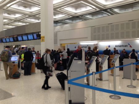 Travelers get their boarding passes at Bush Intercontinental's Terminal A. The Houston Airport System has recommended to arrive three hours before traveling on domestic flights.