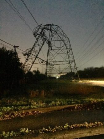 Power lines are bent and toppled by a storm near Urh Lane and Higgins Road on the Northeast Side late Sunday night bringing with it heavy rain and one confirmed tornado.