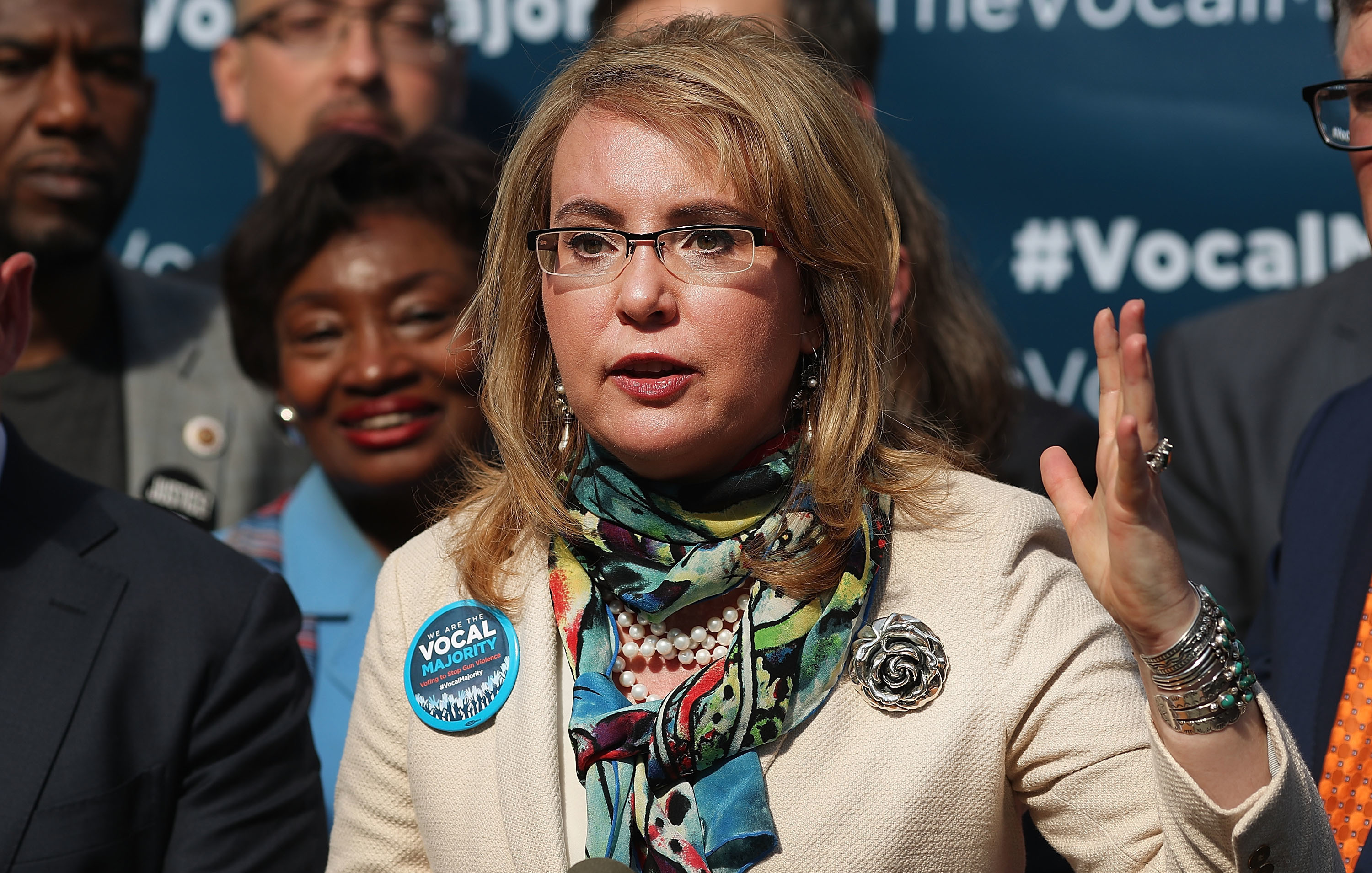 Former Rep. Gabrielle Giffords says lawmakers should "have some courage" and face their constituents at town halls, despite protests.
